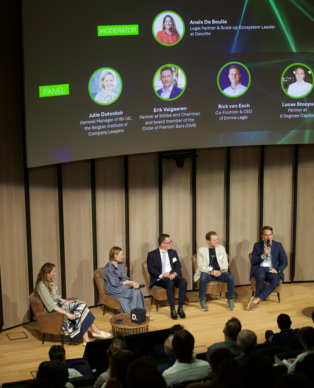 Panelists discussing on stage at the Belgian LegalTech Initiative event.